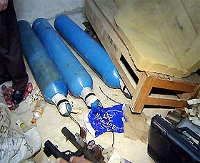 A handout picture from Syria's state news agency SANA shows gas cylinders and rocked-propelled grenades found in a house in the diplomatic quarter of Damascus on Wednesday