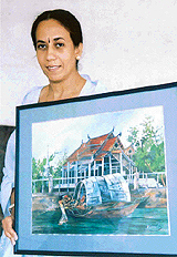 Kamal Kandhari with one of her water-colour paintings.