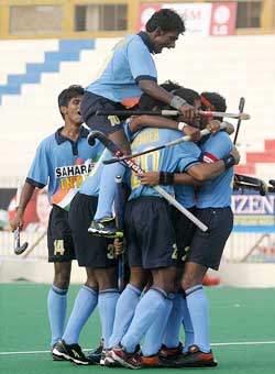 Indian field hockey players celebrate their victory over Pakistan in the final match of the 5th Junior Asia Cup Hockey Tournament