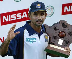 Sri Lanka cricket captain Marvan Atapattu waves after getting the one-day international series trophy against Zimbabwe