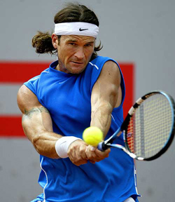 Spain�s Carlos Moya returns a shot to Germany�s Daniel Elsner during their second round match at the Barcelona Open in Barcelona, Spain