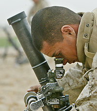 A US marine adjusts his mortar near the town of Falluja on Thursday