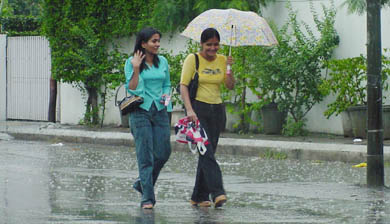 Girls enjoy the rain in Ludhiana on Friday