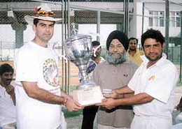 Indian Airlines skipper Vijay Dahiya (right) and Nikhil Chopra receiving the Pepsi Trophy of the Om Nath Sood Memorial Cricket Championship 
