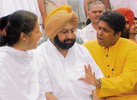 Chief Minister Amarinder Singh listens while the Congress candidate from Ludhiana, Mr Munish Tiwari, tries to explain a point to the AICC general secretary, Ms Ambika Soni