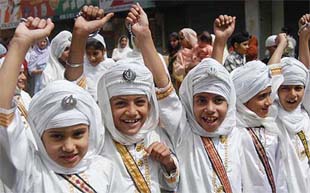Young girls during a religious procession taken out on the occasion of Gurpurb