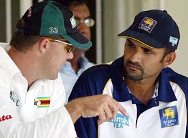 Former Zimbabwe cricket captain Heath Streak chats with Sri Lanka captain Marvan Atapattu