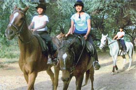 Girls practise at the Chandigarh Horse Riding Society at Lake Club in Chandigarh
