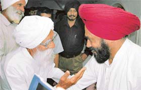 Mr Shamsher Singh Dullo interacts with an ex-serviceman at Mohali
