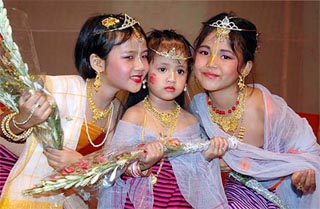 Winner of the Miss Chrouba Children Beauty contest Anna Devi, 1st runner-up Surekha Devi (centre) and 2nd runner-up Sheely Devi pose for photographers 