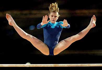 European champion Alina Kozich of Ukraine performs on the uneven bars during the European women's individual all-round gymnastics championships at the RAI stadium