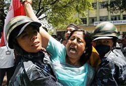 Police personnel in the Nepalese capital Kathmandu arrest Deputy Speaker of the Lower House Chitra Lekha Yadav