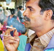 The ban on smoking goes up in the air as a city resident puffs away at a public place in Chandigarh on Monday