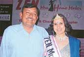 Mrs Homemaker 2004, Ms Ashi Prashar, is all smiles as she poses with her husband, Col Neeraj Prashar.