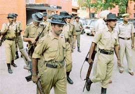 BSF jawans prepare for a patrol in Mohali on Monday. 