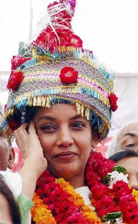 Acclaimed Bollywood actress Shabana Azmi wears a colourful headgear