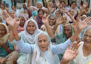Old age and widow pensioners hold a protest against the Punjab Government for not disbursing the amount due to them in Amritsar on Monday.