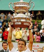Spain's Tommy Robredo raises the Godo's Cup after winning the final against Argentina's Gaston Gaudio in the Godo Tennis Tournament in Barcelona, Spain 