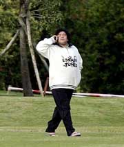 Former Argentine football star Diego Maradona talks on the phone at a country house in the town of General Rodriguez