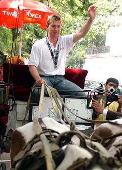 Australian speedster Brett Lee drives  a buggy during a function in Kolkata on Monday