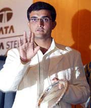 Sourav Ganguly holds a memento during a felicitation ceremony in Kolkata 