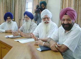 Mr Tarlochan Singh, Chairman of the National Commission for Minorities, and Mr Manjit Singh Calcutta, secretary, SGPC, attend a meeting of a 21-member committee, appointed by Akal Takht, to bring together the two warring groups of the Chief Khalsa Diwan.