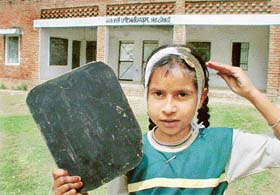 Narenderjit Kaur, a student of Class V, shows her injuries outside Government Primary School, Morthikri