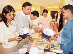 Rotarians buy caps and other material to offer financial aid to the poor. 