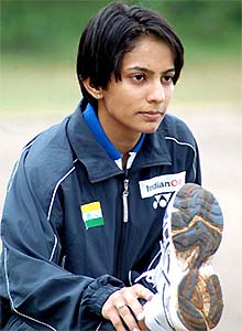 Badminton star Aparna Popat, who has qualified for the Olympics, stretches during a practice session at the Sports Authority of India campus 