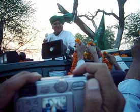 Haryana Chief Minister Om Parkash Chautala addresses villagers from his Vijay Rath