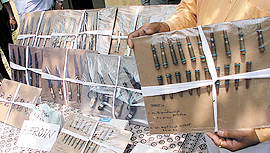 The rich haul of narcotics and arms and ammunition, seized from an interstate gang in the Capital on Saturday. 