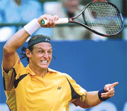 David Nalbandian of Argentina reacts after losing a point during his semifinal match against Albert Costa