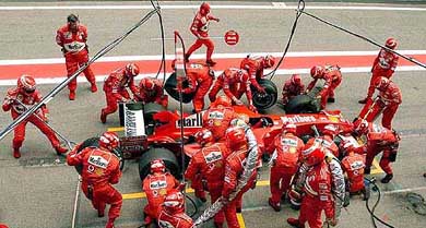 Michael Schumacher of Germany sits in his Ferrari during a pit stop at the Spanish Grand Prix at the Montmelo circuit on the soutskirts of Barcelona