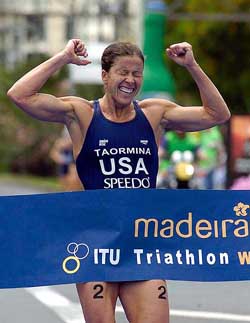 Sheila Taormina, of the USA, celebrates while crossing the finish line to win the Madeira World Triathlon Championship on Sunday in Funchal, Madeira Island