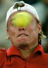 Lleyton Hewitt of Australia eyes the ball during his first round match against Jonas Bjorkman of Sweden at the Hamburg Masters Tennis