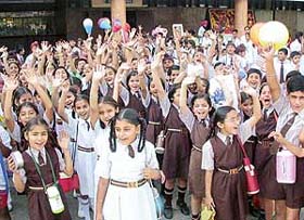 Raising hands in anticipation, students of different schools wait outside Bassi theatre in Mohali to watch a movie as part of The Tribune in Education programme