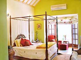 The bedrooms have been done with a minimalist approach, with four-poster beds and bay windows overlooking the Leisure Valley opposite the house