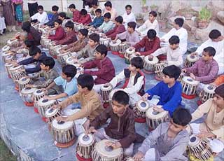 Artistes in the age-group of 5 to 10 rehearse for a mass tabla competition in Ahmedabad 