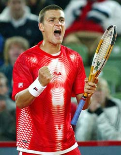 Russian Mikhail Youzhny shouts out in joy after winning a point in his first-round match against German Nicolas Kiefer at the Tennis Masters