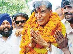 Mr Pawan Kumar Bansal, Congress candidate, greets his supporters following his victory in the Chandigarh parliamentary constituency on Thursday.