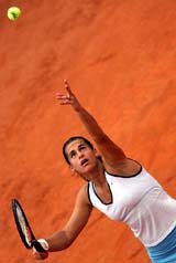 France's Amelie Mauresmo serves to compatriot Nathalie Dechy during their match at the Rome Masters WTA tournament