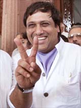 Bollywood star and first-time MP Govinda flashes a victory sign 