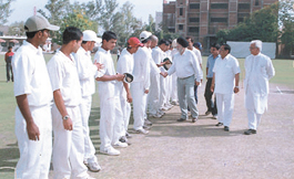 Khalsa College principal Dr D S  Clair meeting the players before the start of the Goswami Ganesh Dutt Cricket Tournament on Sunday.