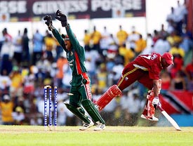 Dwayne Bravo of the West Indies being run out by Bangladesh's Mohammad Rafique 