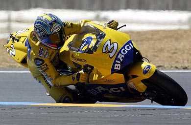 Italian MotoGP rider Max Biaggi speeds his Honda  to take the third place in the French Grand Prix 