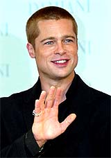 US actor Brad Pitt waves to photographers during a reception in Tokyo on Sunday