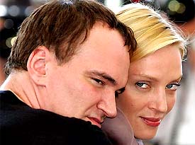 US director Quentin Tarantino poses with US actress Uma Thurman during a photocall for their film Kill Bill Vol. 2