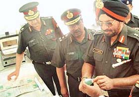 Lieut-Gen J.J. Singh, General Officer Commanding-in-Chief, Western Command (extreme right), inspects the fabricated artificial denture after inaugurating a dental laboratory complex of Command Hospital, Chandi Mandir