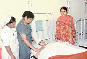 A nursing officer in pre-2001 white dress