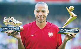 Arsenal's French striker Thierry Henry poses with his Golden Boot and Player of the Year awards 